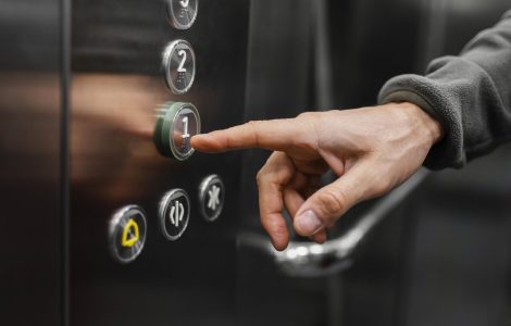 delivery-man-with-package-elevator-close-up